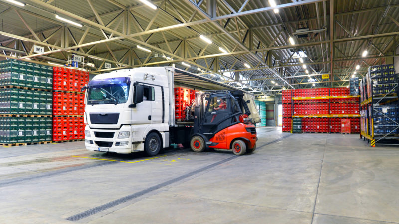 shipping - loading of a truck in a warehouse by forklift